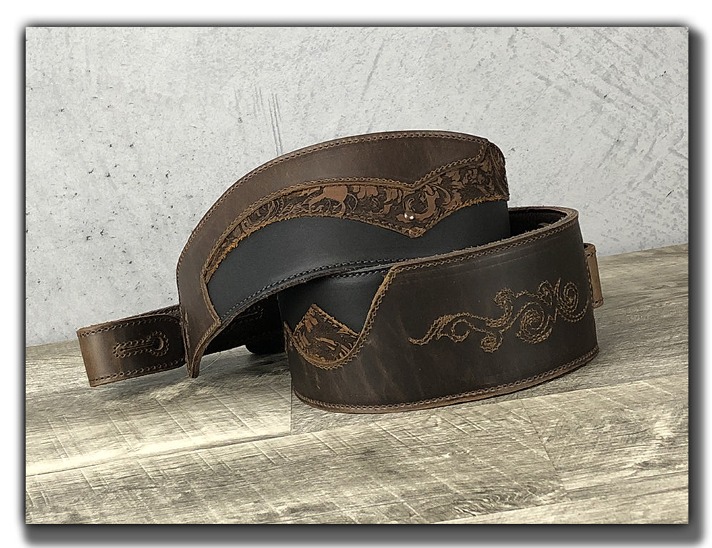 https://www.anthologygearwear.com/cdn/shop/products/leather-guitar-strap-embroidered-brown-coiled.jpg?v=1607291325&width=997