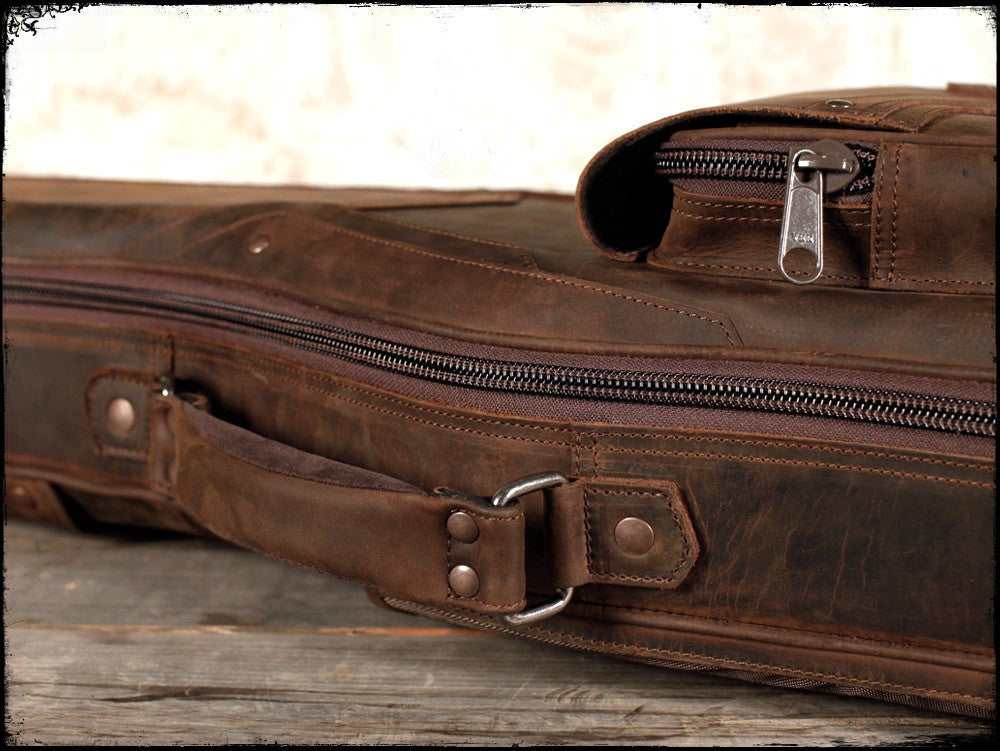 Brown leather guitar deals case